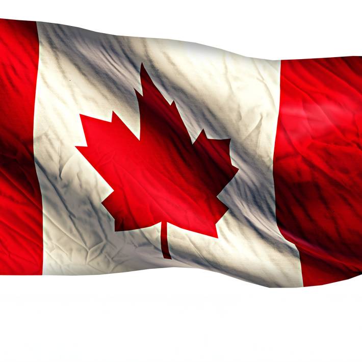 Image of a large Candad Flag waving